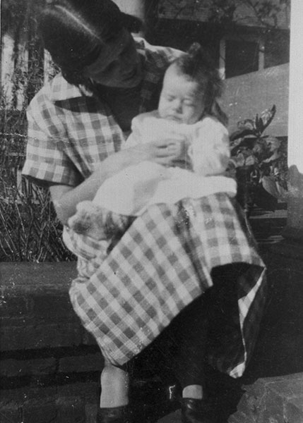 Lillian Carter holding Jimmy Carter as a baby (black and white image).