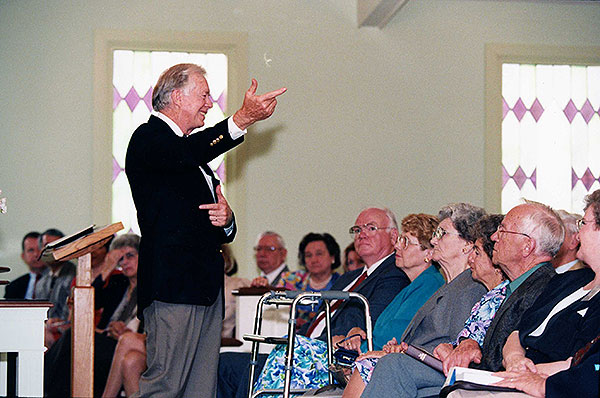 Jimmy Carter standing before his church congregation.