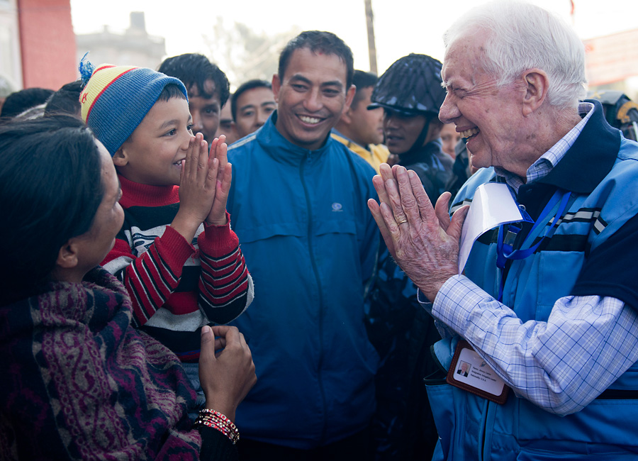  Jimmy Carter greets a Nepali boy.