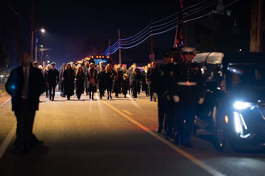 President Carter’s family walks behind the hearse.