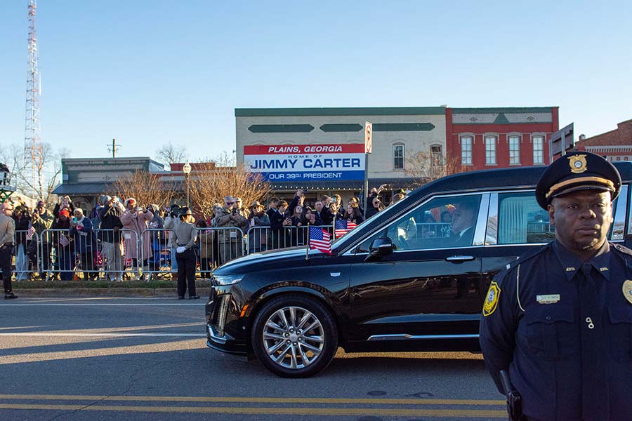 People line the street in downtown Plains.