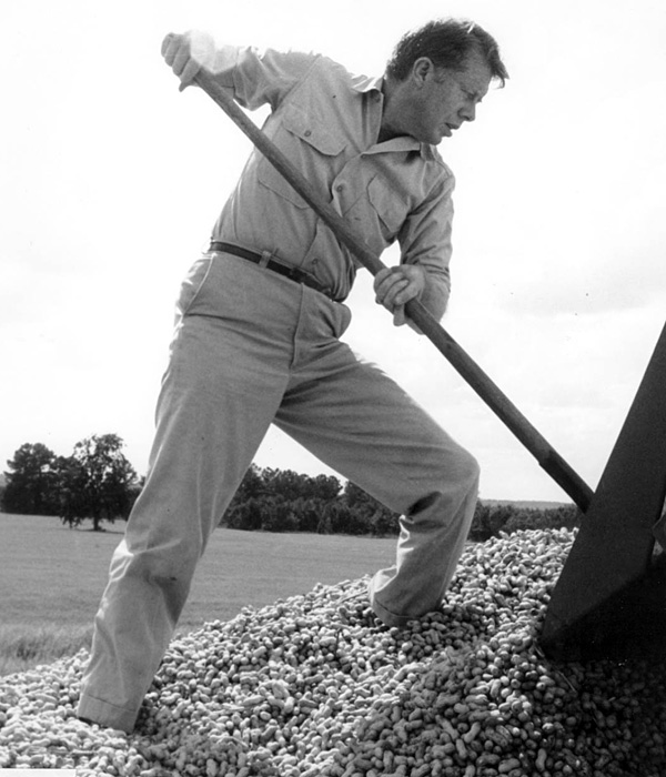 Jimmy Carter shoveling peanuts in 1965.