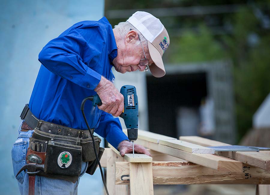 Jimmy Carter drilling wood.